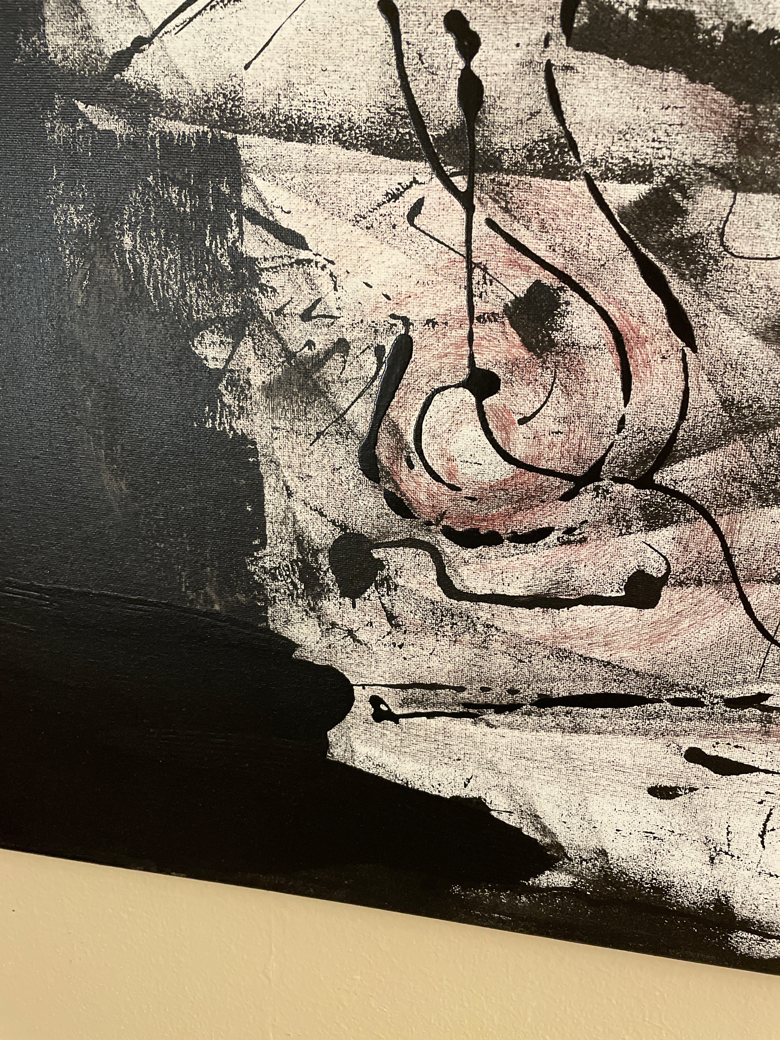 Black-and-white abstract painting on canvas with a distressed pale central field, faint blush tones, broad dark edges and fluid black lines suggesting a fragmented face, body or handwritten notation.